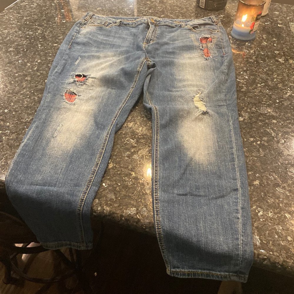 Distressed Lane Bryant jeans with red plaid accents